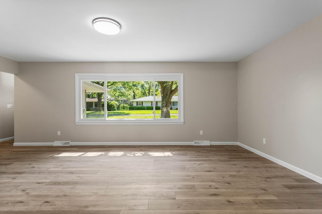 2705 Arlene Dr, Urbana, IL 61802 - spare room with wood finished floors and baseboards