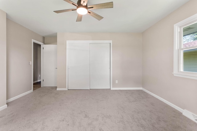 2705 Arlene Dr, Urbana, IL 61802 - unfurnished bedroom featuring carpet flooring, baseboards, a closet, and ceiling fan