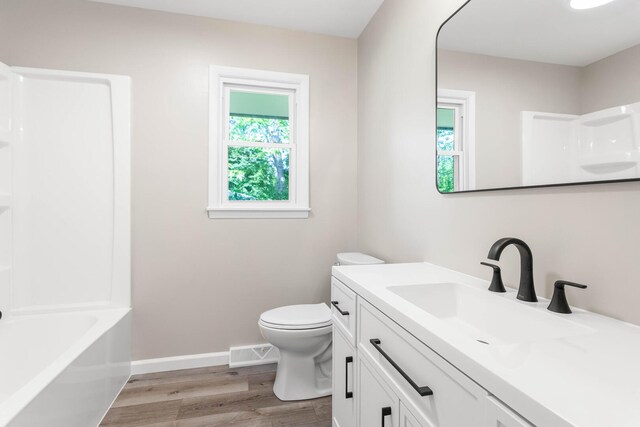 2705 Arlene Dr, Urbana, IL 61802 - bathroom with vanity, wood finished floors, toilet, and baseboards