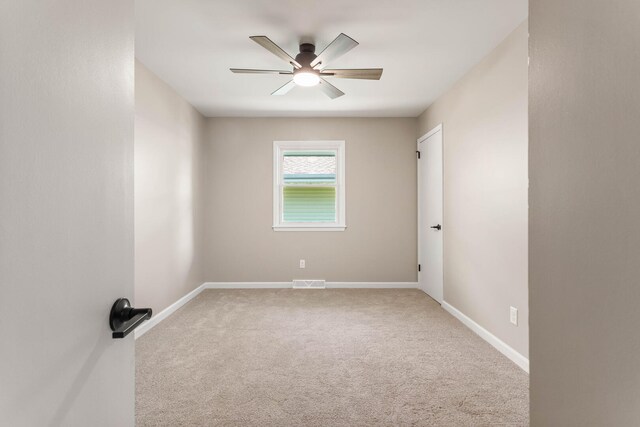 2705 Arlene Dr, Urbana, IL 61802 - empty room featuring carpet flooring, a ceiling fan, and baseboards