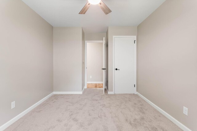 2705 Arlene Dr, Urbana, IL 61802 - unfurnished bedroom with baseboards, carpet flooring, and a ceiling fan