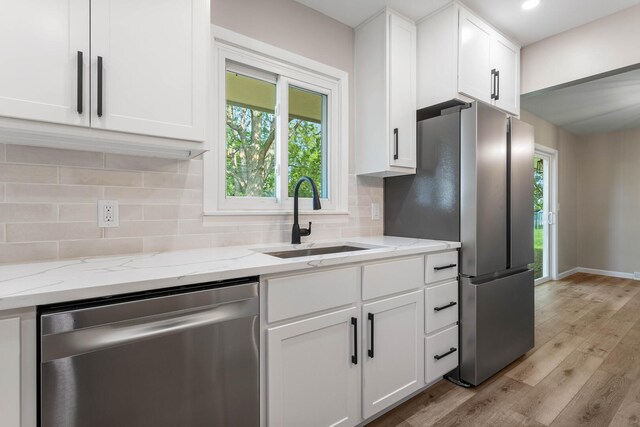 2705 Arlene Dr, Urbana, IL 61802 - kitchen with stainless steel appliances, a sink, light wood-style flooring, white cabinetry, and recessed lighting