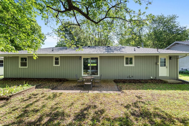 2705 Arlene Dr, Urbana, IL 61802 - back of property featuring a patio, a yard, board and batten siding, and a shingled roof