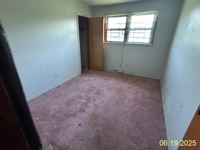 14839 Cooper Ave, Harvey, IL 60426 - unfurnished bedroom with carpet floors