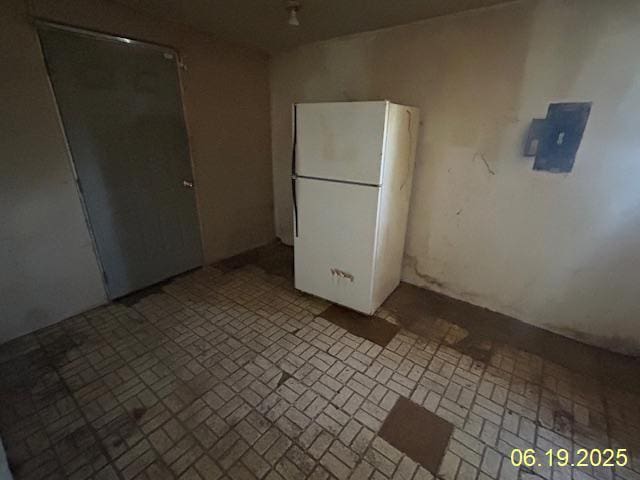 14839 Cooper Ave, Harvey, IL 60426 - kitchen featuring freestanding refrigerator and brick patterned floors