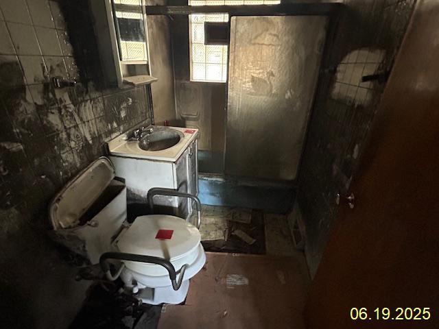 14839 Cooper Ave, Harvey, IL 60426 - full bathroom with a shower and vanity