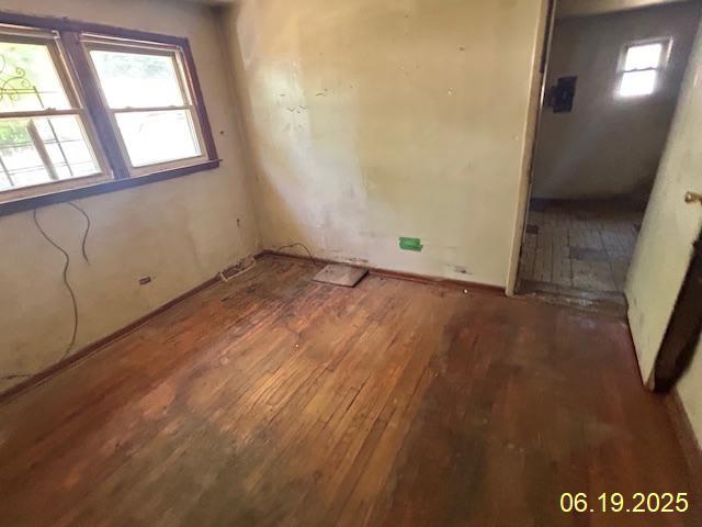 14839 Cooper Ave, Harvey, IL 60426 - spare room featuring hardwood / wood-style floors and plenty of natural light