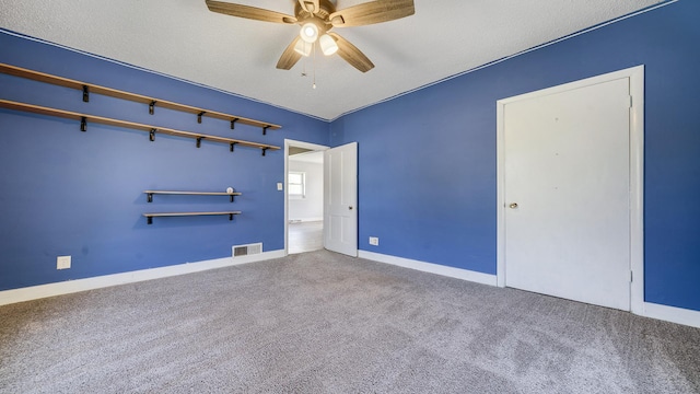 630 Willett Ave, Dixon, IL 61021 - unfurnished bedroom with carpet floors, baseboards, and a ceiling fan
