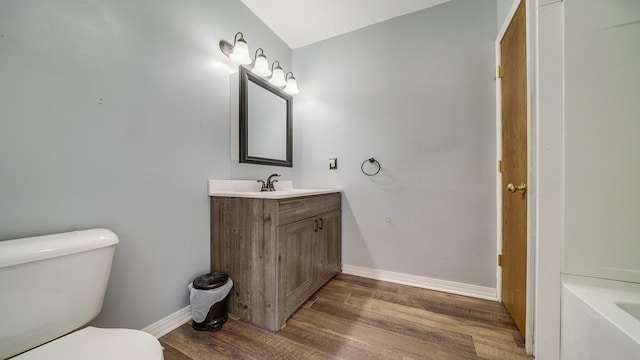 630 Willett Ave, Dixon, IL 61021 - full bathroom featuring wood finished floors, toilet, vanity, and baseboards