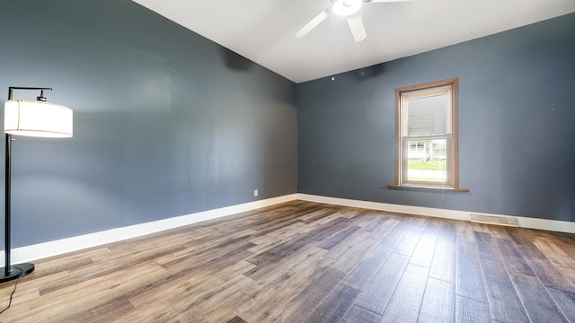 630 Willett Ave, Dixon, IL 61021 - spare room featuring a ceiling fan, wood finished floors, and baseboards