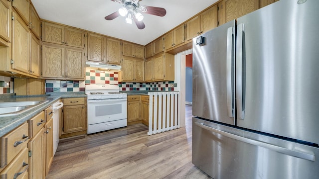 630 Willett Ave, Dixon, IL 61021 - kitchen with white appliances, ventilation hood, a ceiling fan, decorative backsplash, and light wood-style floors