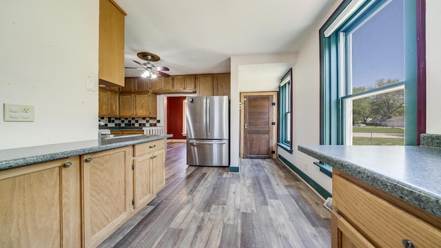 630 Willett Ave, Dixon, IL 61021 - kitchen with freestanding refrigerator, wood finished floors, backsplash, ceiling fan, and baseboards