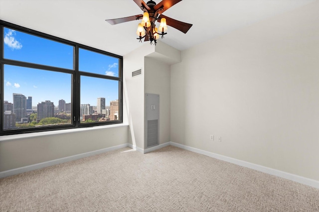233 E 13th St Unit 2209, Chicago, IL 60605 - carpeted spare room featuring ceiling fan, baseboards, and a view of skyline
