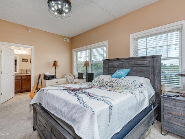 17200 Oak Park Ave Unit R-206, Tinley Park, IL 60477 - bedroom with light colored carpet, ensuite bathroom, and visible vents