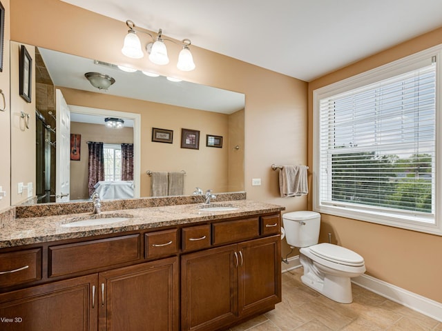 17200 Oak Park Ave Unit R-206, Tinley Park, IL 60477 - bathroom featuring baseboards, toilet, a sink, and double vanity