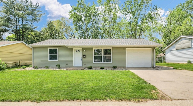 1501 Lincolnwood Dr, Urbana, IL 61802 - ranch-style house featuring driveway, a garage, a front lawn, and roof with shingles