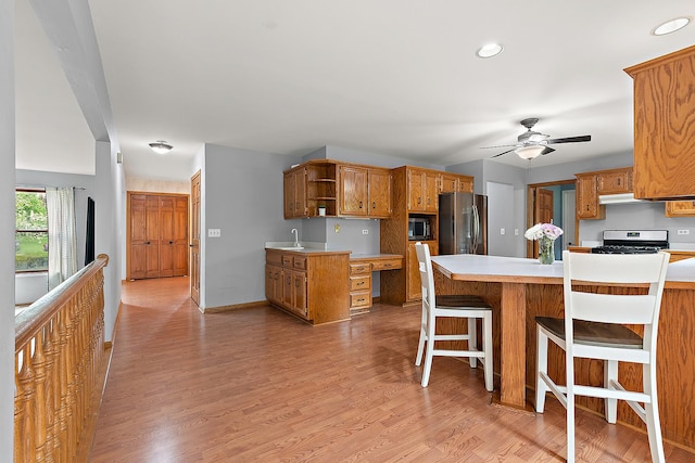 12318 W Donegal Ln, New Lenox, IL 60451 - kitchen featuring stainless steel appliances, open shelves, light countertops, a ceiling fan, and a peninsula