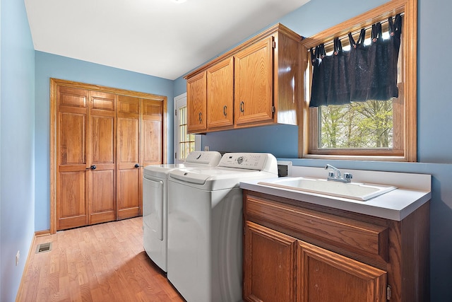 12318 W Donegal Ln, New Lenox, IL 60451 - laundry room with cabinet space, washer and dryer, and light wood finished floors