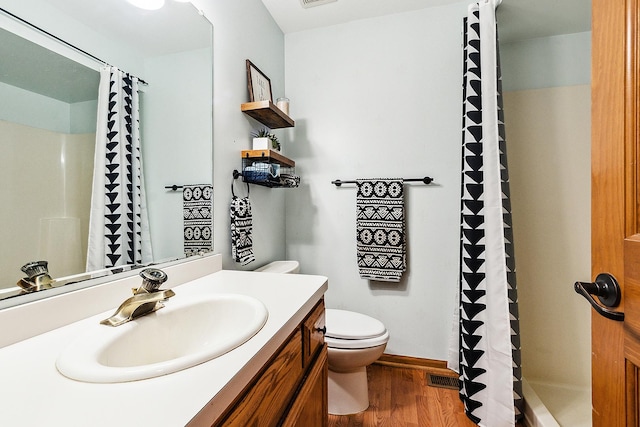 12318 W Donegal Ln, New Lenox, IL 60451 - bathroom featuring toilet, wood finished floors, vanity, a shower with curtain, and baseboards