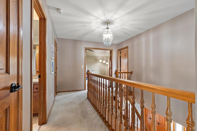 12318 W Donegal Ln, New Lenox, IL 60451 - hallway featuring an upstairs landing, light carpet, baseboards, and a chandelier