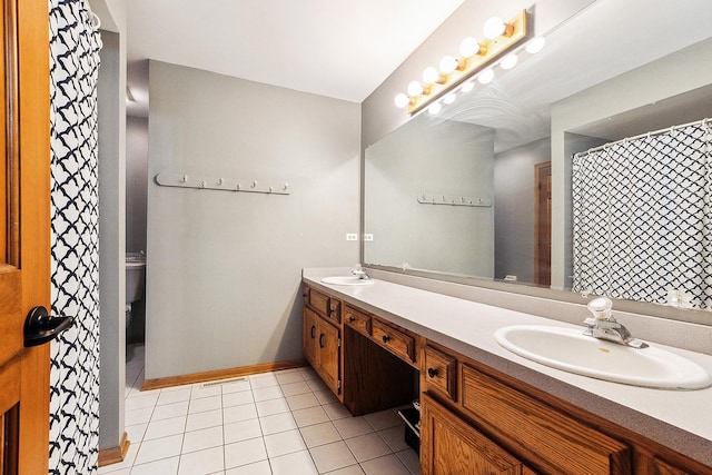 12318 W Donegal Ln, New Lenox, IL 60451 - full bath with double vanity, tile patterned flooring, toilet, and baseboards