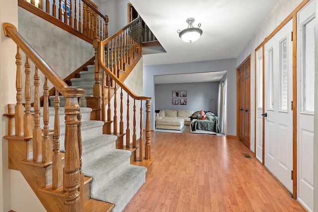 12318 W Donegal Ln, New Lenox, IL 60451 - foyer entrance featuring wood finished floors and stairway