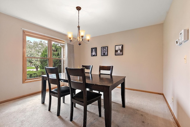 12318 W Donegal Ln, New Lenox, IL 60451 - dining room featuring light carpet, a chandelier, and baseboards