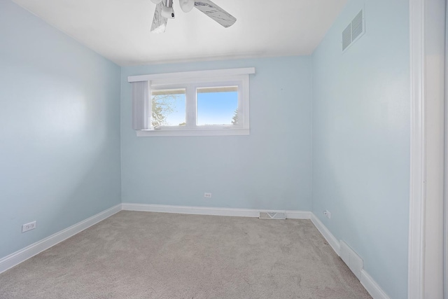 unfurnished room with carpet flooring, baseboards, a ceiling fan, and visible vents