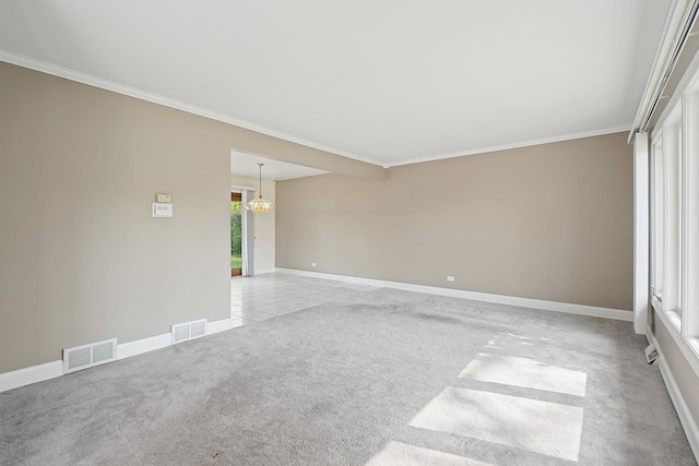 unfurnished room with light colored carpet, crown molding, and visible vents