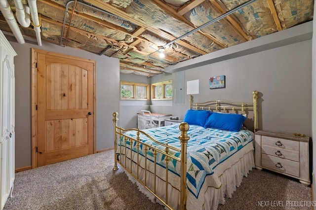 carpeted bedroom featuring baseboards