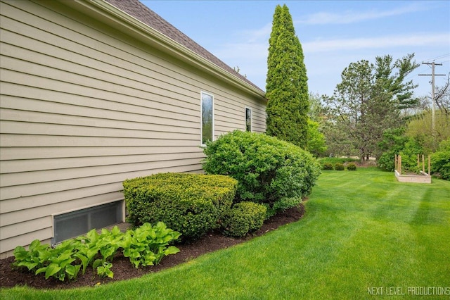 view of property exterior featuring a lawn
