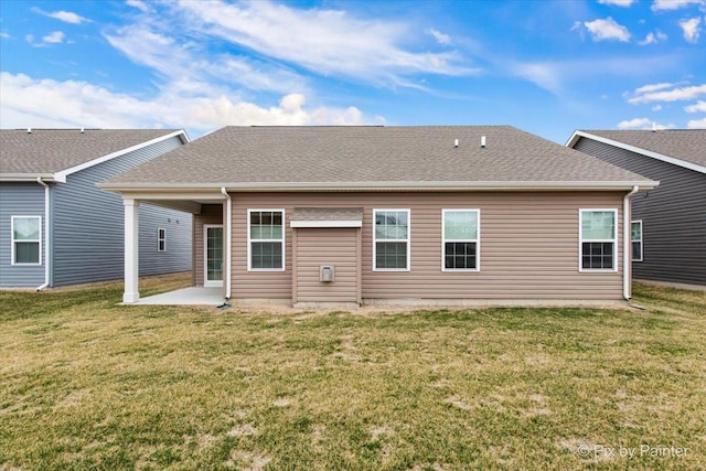 3610 Reddington Cir, Elgin, IL 60124 - rear view of house featuring a yard, a patio, and a shingled roof