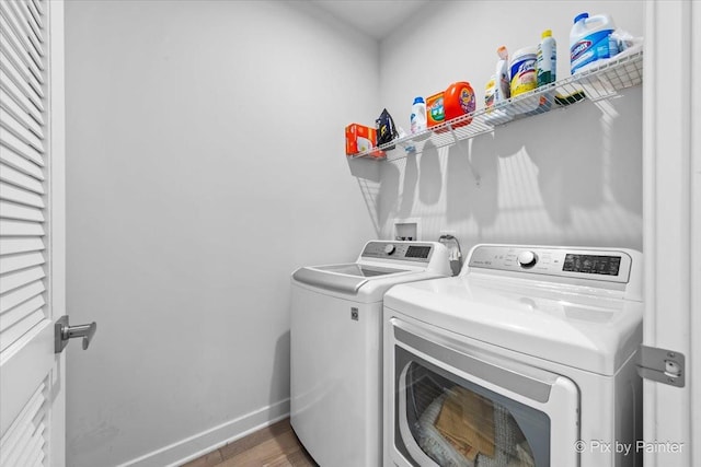 3610 Reddington Cir, Elgin, IL 60124 - clothes washing area with laundry area, baseboards, separate washer and dryer, and wood finished floors
