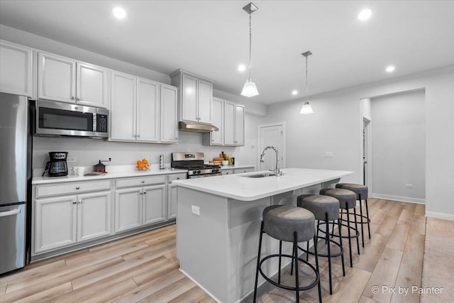 3610 Reddington Cir, Elgin, IL 60124 - kitchen with under cabinet range hood, stainless steel appliances, recessed lighting, and a sink