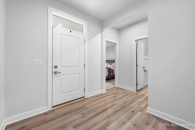 3610 Reddington Cir, Elgin, IL 60124 - entryway with baseboards and light wood finished floors