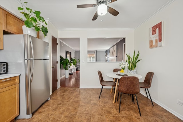 6259 N NW Hwy Unit 3D, Chicago, IL 60631 - dining area featuring crown molding, baseboards, and ceiling fan
