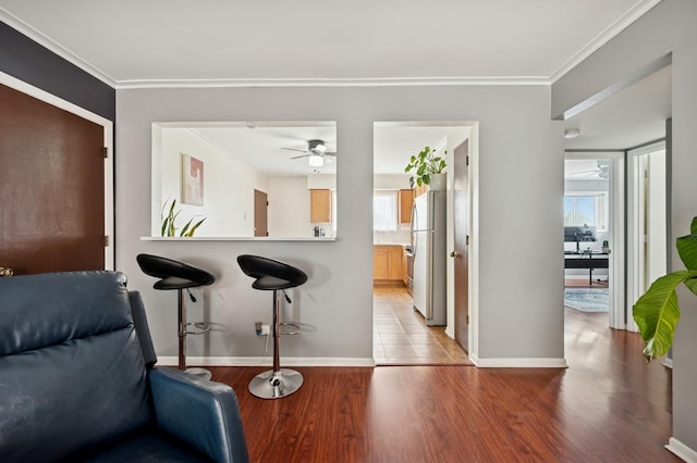 6259 N NW Hwy Unit 3D, Chicago, IL 60631 - kitchen with a ceiling fan, baseboards, freestanding refrigerator, and light wood-style flooring