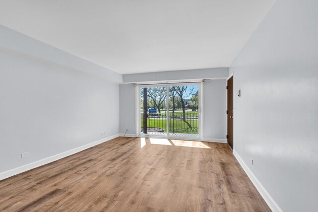 503 Mchenry Rd Unit 2A, Wheeling, IL 60090 - unfurnished room with wood finished floors and baseboards
