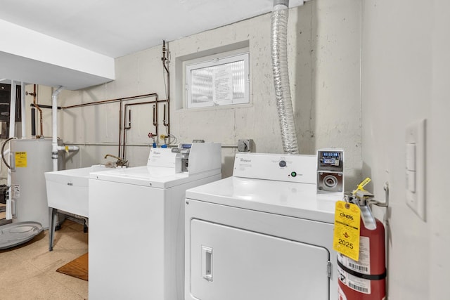 503 Mchenry Rd Unit 2A, Wheeling, IL 60090 - clothes washing area with washing machine and dryer, electric water heater, light floors, and a sink