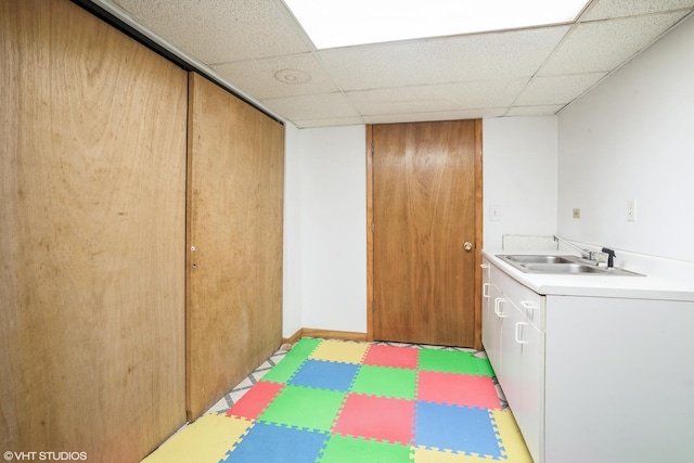 1319 President St, Glendale Heights, IL 60139 - clothes washing area featuring cabinet space, tile patterned floors, and a sink