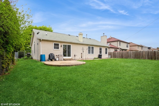 1319 President St, Glendale Heights, IL 60139 - rear view of property featuring a lawn, a chimney, a patio, and a fenced backyard