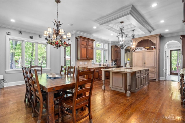4779 Lees Ct, Oswego, IL 60543 - dining space with a chandelier, ornamental molding, arched walkways, dark wood-style floors, and recessed lighting