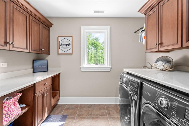 4779 Lees Ct, Oswego, IL 60543 - laundry room featuring washer and dryer, cabinet space, and baseboards
