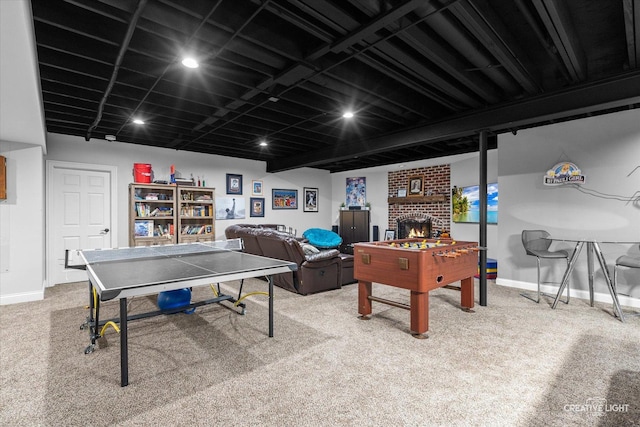 4779 Lees Ct, Oswego, IL 60543 - recreation room featuring baseboards, carpet, and a fireplace