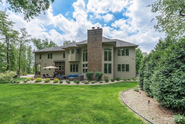 4779 Lees Ct, Oswego, IL 60543 - rear view of house with outdoor lounge area, a patio area, a chimney, and a lawn
