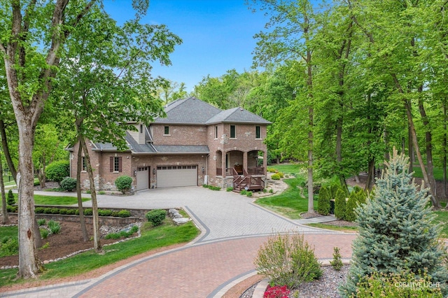 4779 Lees Ct, Oswego, IL 60543 - traditional-style house with a garage, decorative driveway, and brick siding