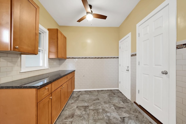 2720 S Christiana Ave, Chicago, IL 60623 - kitchen with tile walls, brown cabinets, and a ceiling fan