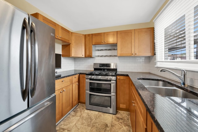 2720 S Christiana Ave, Chicago, IL 60623 - kitchen with dark stone counters, backsplash, stainless steel appliances, and a sink