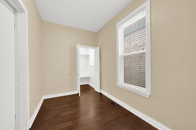2720 S Christiana Ave, Chicago, IL 60623 - interior space featuring a closet, a walk in closet, dark wood finished floors, visible vents, and baseboards