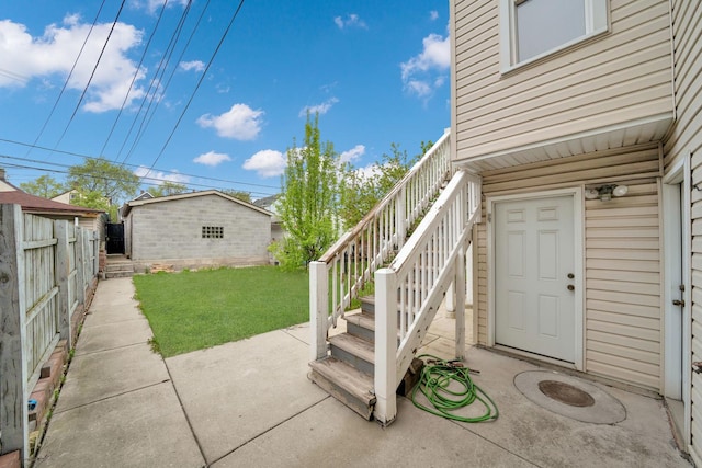 2720 S Christiana Ave, Chicago, IL 60623 - doorway to property with a patio area, fence, and a lawn